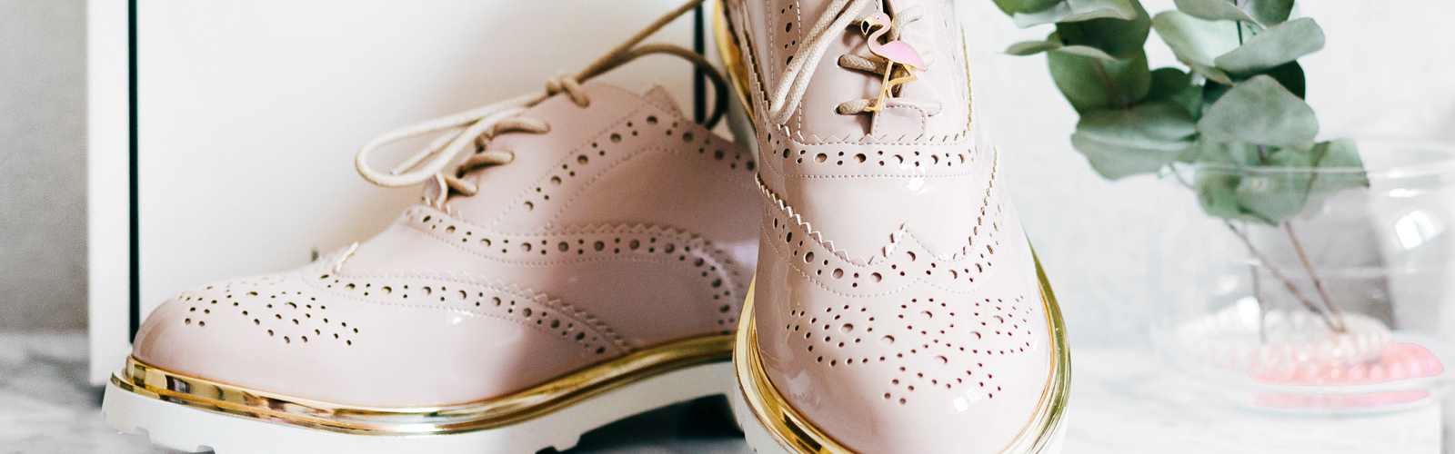 A pair of pink brogue shoes